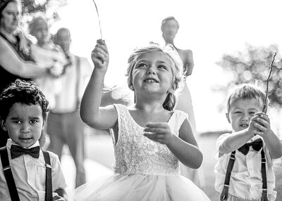 cute flower girl waving wand at Disney's wedding pavilion