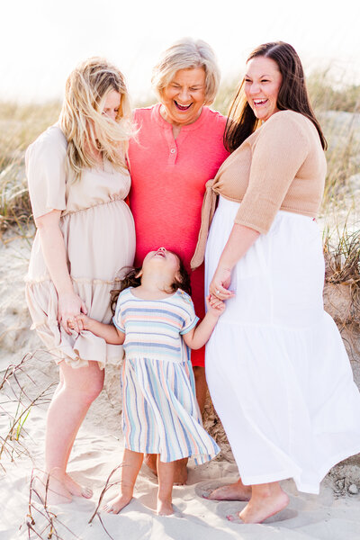 A shot of a family photo session with just the women with Ron Schroll Photography at Ocean Isle Beach, NC