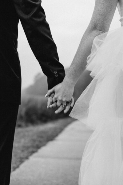 Bride and groom holding hands, Wilmington NC wedding photography by D McHugh
