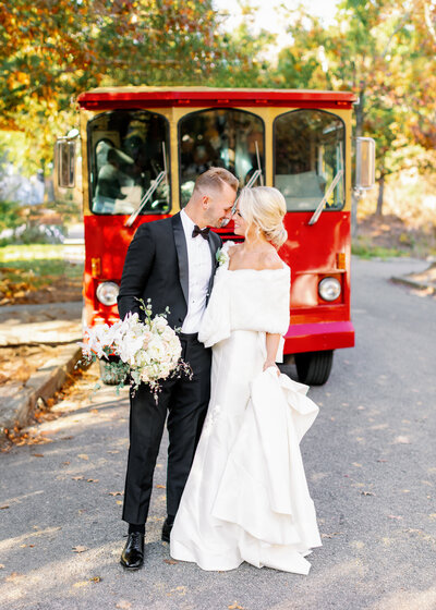 Bride and Groom in front of vintage trolley | Threefold Events Wedding | Maddie Moore Photography