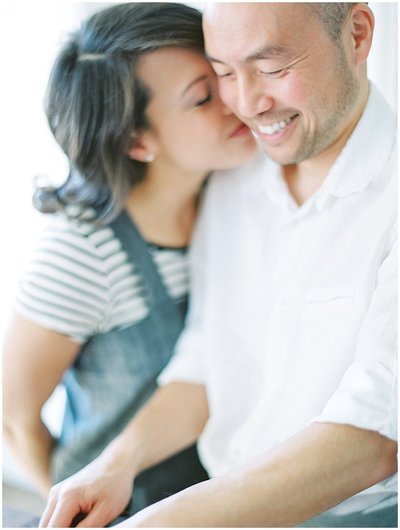 Bride and Groom Who Love to Cook In the Kitchen Cooking Together During Unique Engagement Photos by Denver Wedding Photographer © Bonnie Sen Photography