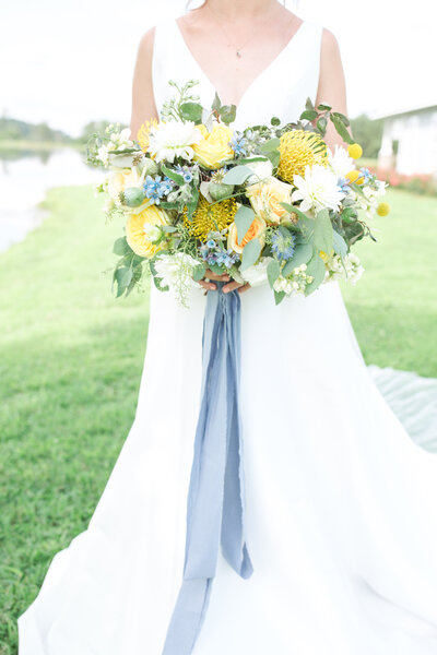 Yellow and blue wedding bouquet at Flagstone Farm in Tuscaloosa Alabama