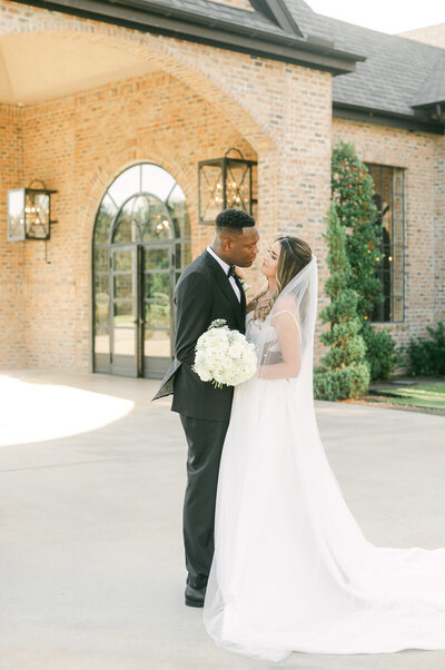 bride and groom outside iron manor