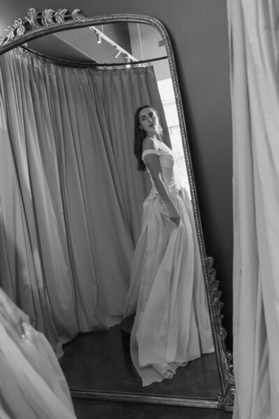 black and white image bride wearing strapless satin wedding dress