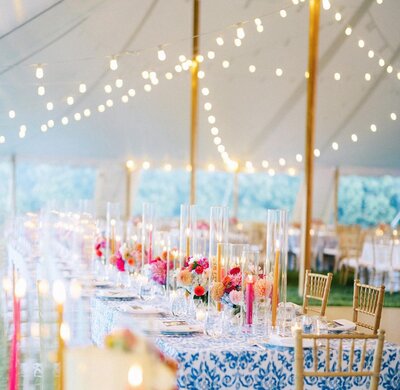 Tented wedding with candles and string lights