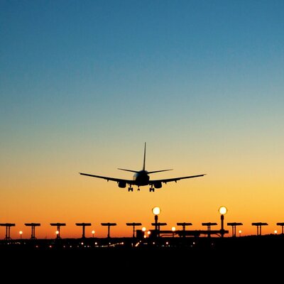 plane landing at sunset