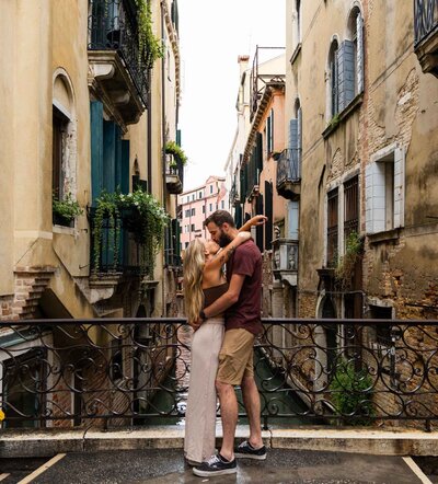 Couple kissing in front of their friends in the Rocky Mountain National Park