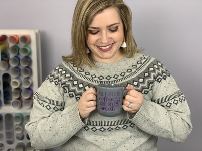 Alex of DIY Alex holds a mug from her Cricut for Beginners tutorials