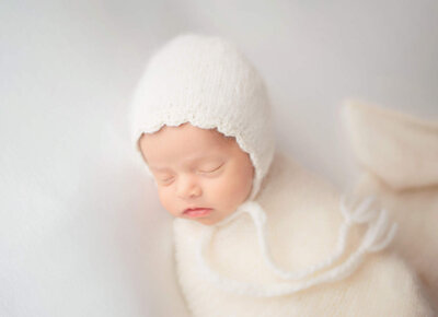 Sweet newborn girl sleeping for her session with Encinitas  newborn photographer Tristan Quigley