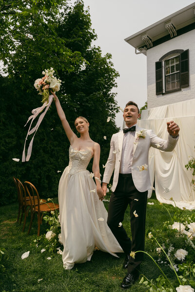 Bride and groom ceremony photo at Maxwell Mansion in Lake Geneva with florals and draping.
