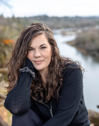 female photographer standing on rock