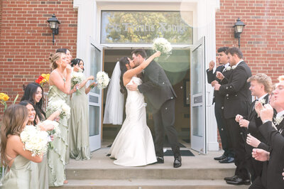 Groomsmen hugging on Groom as the anticipation of the wedding ceremony builds. Captured by Pittsburgh Wedding photographer Lens Love Photography.