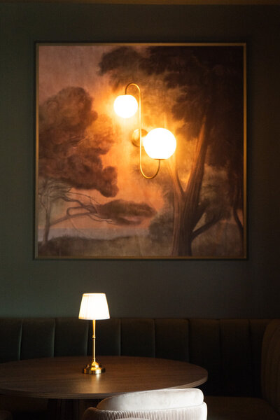 Elegant dining room at Revé in Niagara-on-the-Lake featuring an open live-fire hearth and modern design