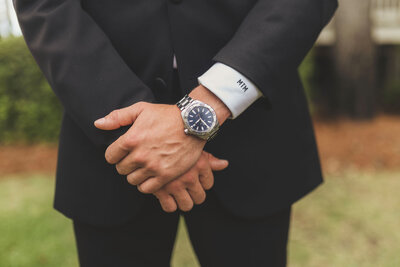 A close up of a groom's watch.