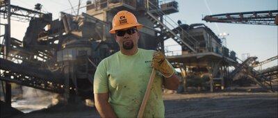 construction man holding rake