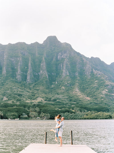couple on secret dock in oahu hawaii by Natalie Jayne Photography