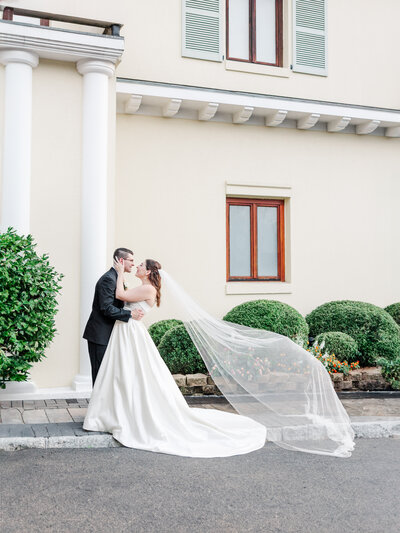 bride and groom embracing romantically