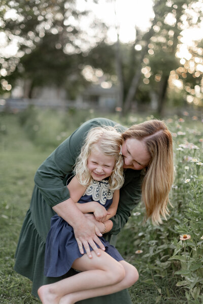 family photographer outside with camera for behind the scenes shot