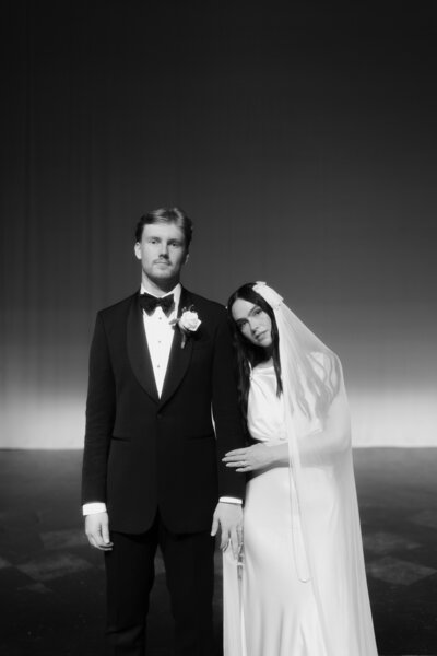 Black and white cinematic wedding portrait of a bride and groom in Solihull, captured by Luis Calow in a editorial photography style.