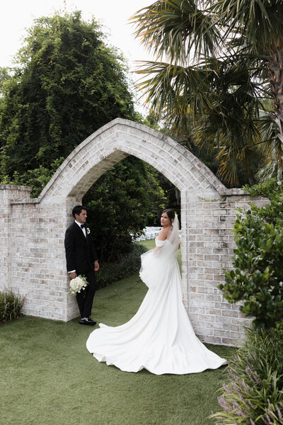 bride with parasol and modern satin gown at wrightsville manor