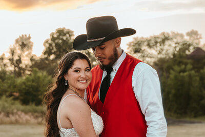 A sweet moment shared between the newlywed bride and groom as theyare having their portraits taken by Ocean Drive Photography during sunset.