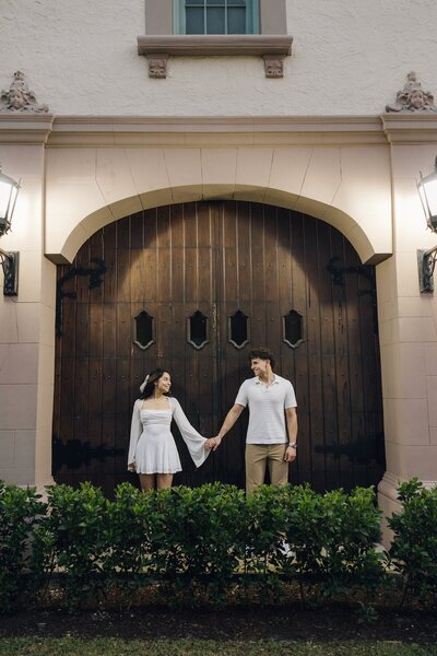 couple holds hands during engagement photos