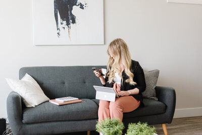 Realtor Tamara Rzan communicating with home buyers and sellers through her phone