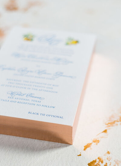 Copper foil edged wedding invitations with blue letterpress and full color digital printing