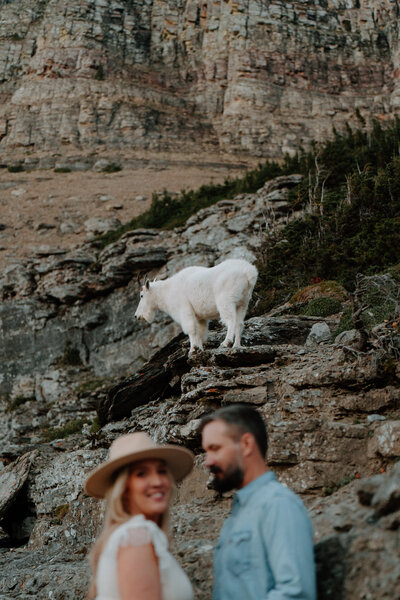 An adventure elopement couple securing their wedding bouquet to their hiking backpack.