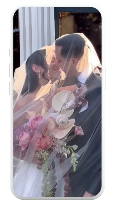 Photo of a phone mockup with a bride and groom in the phone