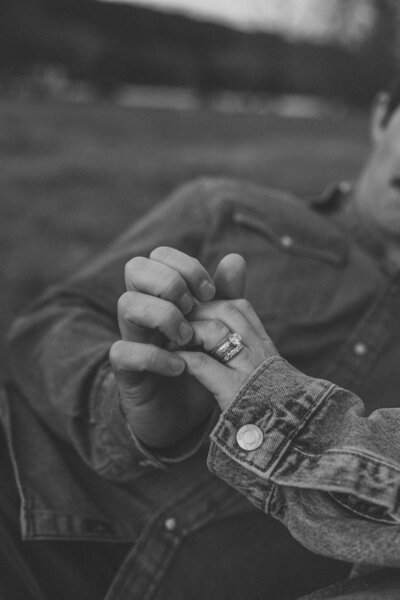 Engaged couple holding hands at South Congress in Austin, photographed by Valeria Ortega, couples photographer.