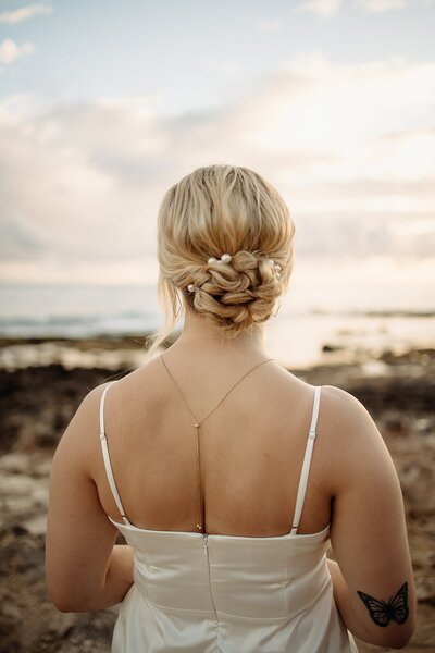 Detail photo of brides updo for beach wedding