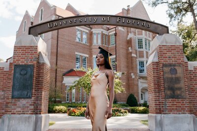 uf graduation pictures in front of uf sign