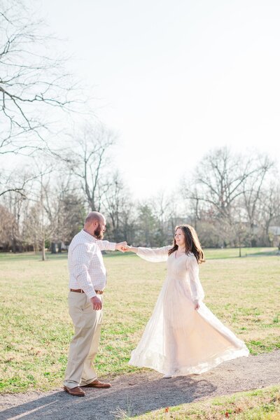 photo of couple in front of a beautiful mansion at their Nashville engagement session