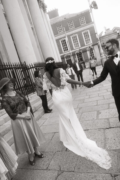 Bride and groom holding hands at their Dublin City Hall in Dublin, Ireland