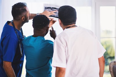 group of male doctors reviewing scans