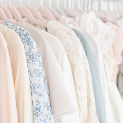 close up image of neutral and pastel colored dresses