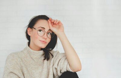 Female feeling lighter after therapy with licensed therapist in Denver