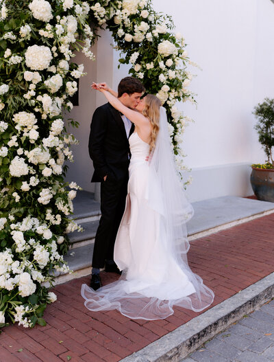 Bride and groom in front of the rosemary beach town hall