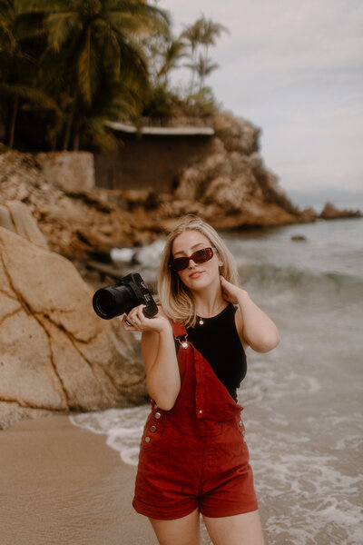 woman posing with red glasses