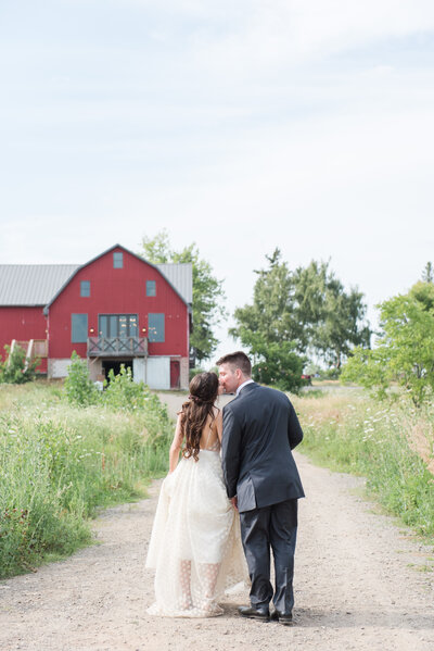 couple near barn at-earth to table farm wedding-1