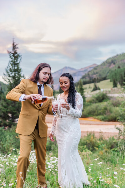 bride smiling up at groom at elk mountain resort in montrose colorado