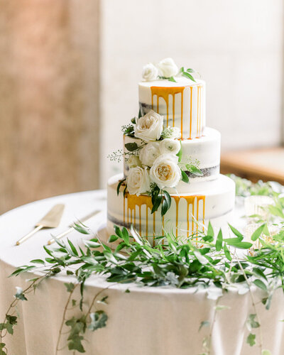 An elegant luxury wedding cake captured at the Banff Springs Hotel reception, showcasing timeless design and sophistication in a breathtaking venue.