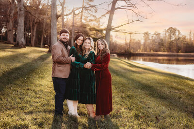 Family poses together for Family Photos at Taylor Ranch in Asheville, NC. 