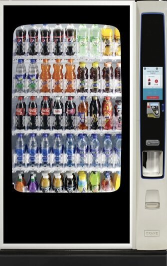 Traditional beverage vending machine fully stocked with soft drinks and water bottles