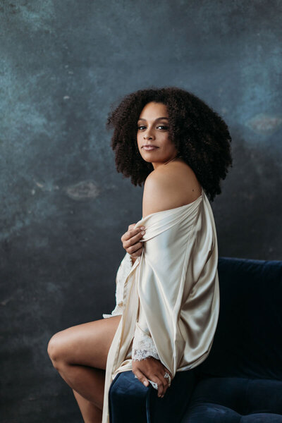 Fine art boudoir portrait of black woman with afro hair