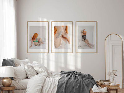 three framed artworks sit above bed from alyce holzy boudoir