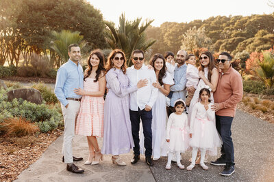 an extended family posing for a photoshoot with auckland photographer michelle kelly