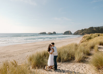 Elizabeth and Michael explored the dramatic coastline with playful, romantic portraits that blended moody skies, windswept dunes, and cozy connection by the waves.