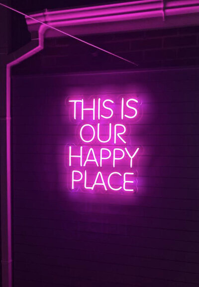 This is our happy place pink neon sign
